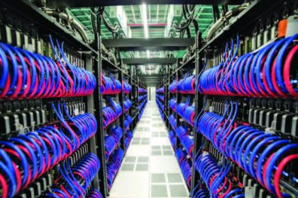 Inside the Frontier supercomputer, a network of tubes carries water to cool thousands of computer chips in the system. Photo Source: Oak Ridge National Laboratory/Hewlett Packard Enterprise